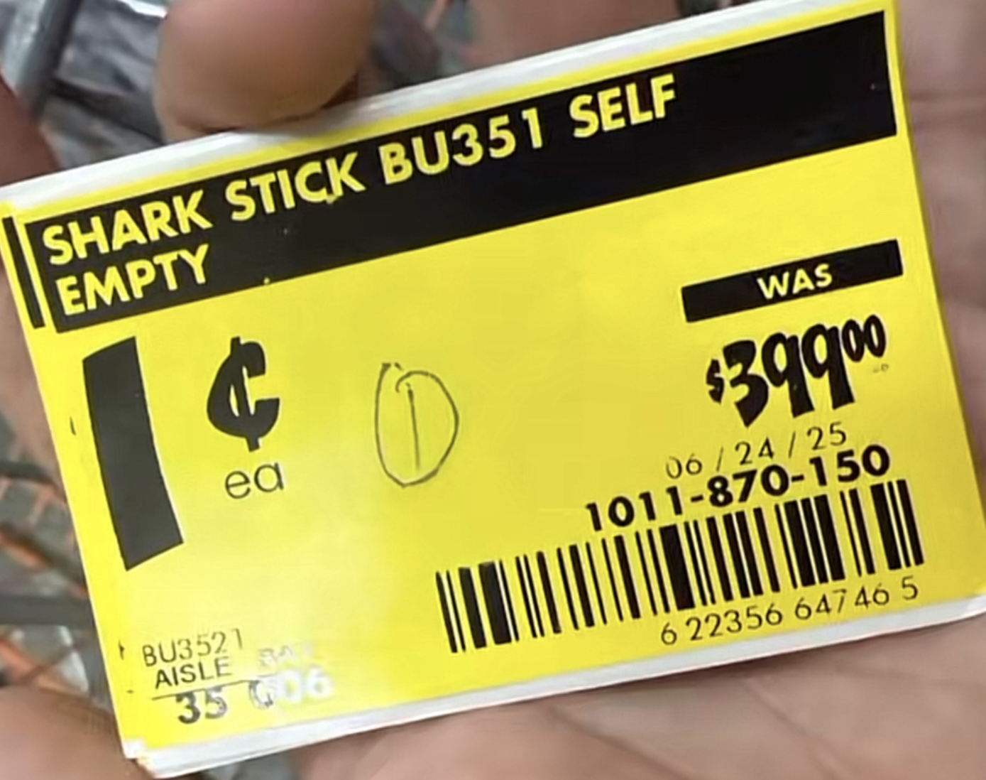 Real Home Depot clearance tag for a Shark stick vacuum showing WAS $399.00 with a new price of one cent.